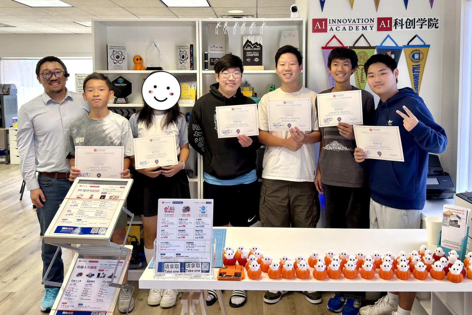Cohort 1 of AI Fluency in our lab, holding their certificates of completion, with their instructor.